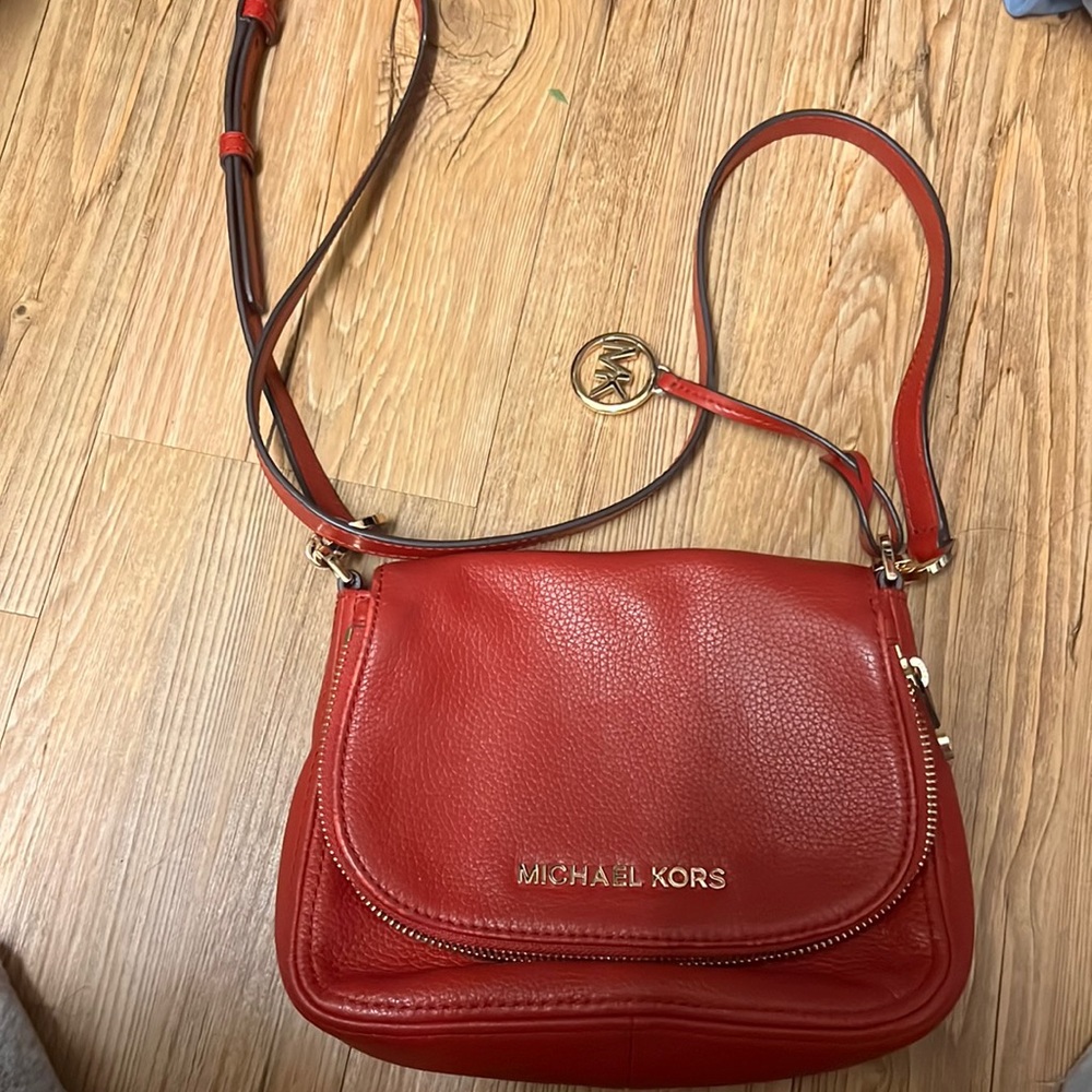 Michael Kors Red zipped fold over cross body bag